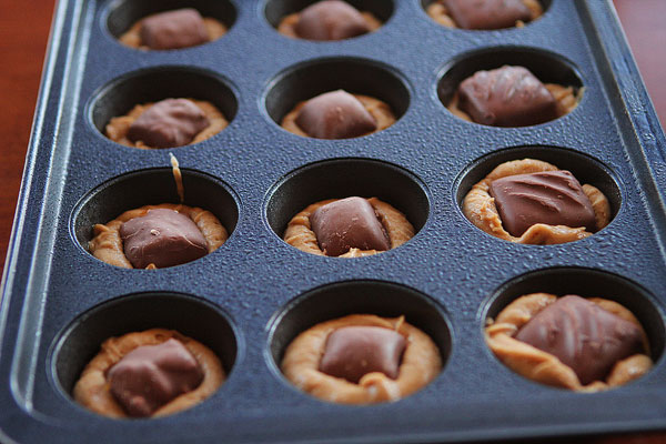 Frosted Candy Bar Stuffed Cookie Cups Frosted Candy Bar Stuffed Cookie Cups