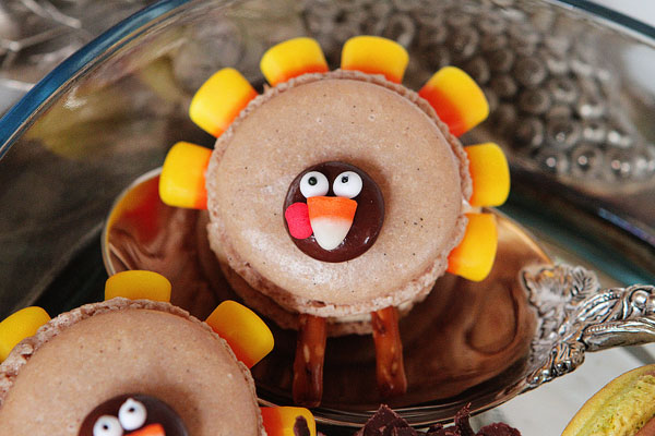 Thanksgiving Themed Holiday Macarons: Caramel Apple Macarons, Chocolate Acorns, and Chocolate Peanut Butter Candy Corn Turkeys Thanksgiving Themed Holiday Macarons: Caramel Apple Macarons, Chocolate Acorns, and Chocolate Peanut Butter Candy Corn Turkeys