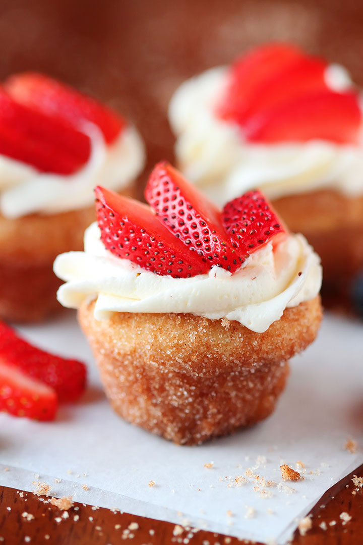 Strawberry Shortcake Doughnut Muffins. These are like little bites of HEAVEN. A muffin that tastes like a doughnut, dunked in brown butter and rolled in cinnamon sugar for a sweet, crunchy crust. Then topped with buttercream frosting and fresh cut strawberries. Amazing. Strawberry Shortcake Doughnut Muffins. These are like little bites of HEAVEN. A muffin that tastes like a doughnut, dunked in brown butter and rolled in cinnamon sugar for a sweet, crunchy crust. Then topped with buttercream frosting and fresh cut strawberries. Amazing.