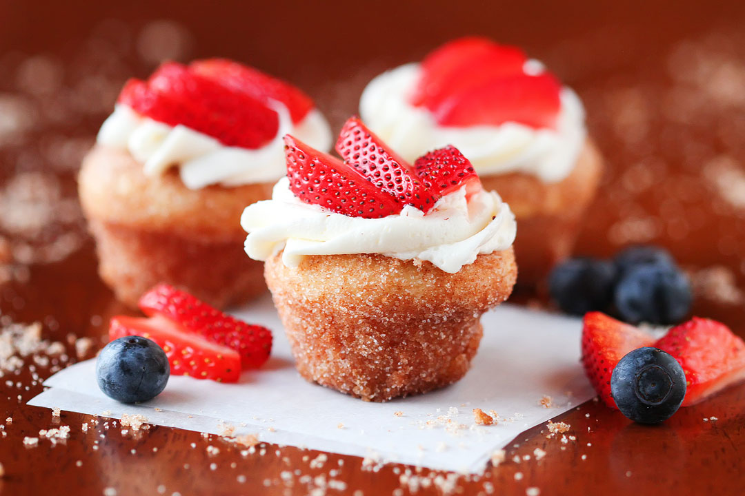 Strawberry Shortcake Doughnut Muffins. These are like little bites of HEAVEN. A muffin that tastes like a doughnut, dunked in brown butter and rolled in cinnamon sugar for a sweet, crunchy crust. Then topped with buttercream frosting and fresh cut strawberries. Amazing. Strawberry Shortcake Doughnut Muffins. These are like little bites of HEAVEN. A muffin that tastes like a doughnut, dunked in brown butter and rolled in cinnamon sugar for a sweet, crunchy crust. Then topped with buttercream frosting and fresh cut strawberries. Amazing.