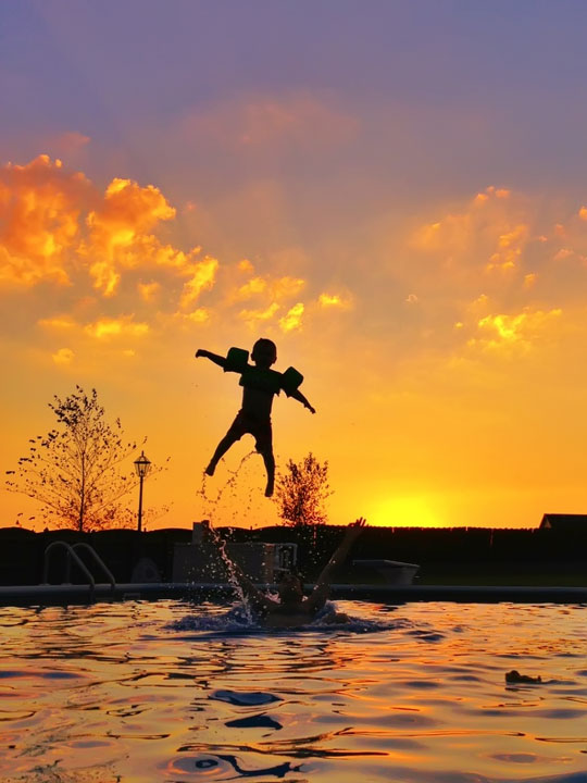 Silhouettes in Front of a Sunset Image of Silhouettes in Front of a Sunset