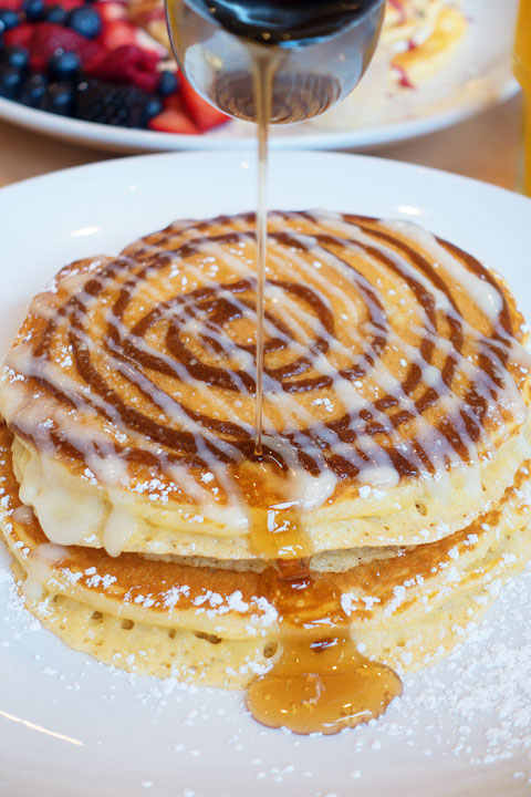 Cinnamon Bun Pancake Image of a Cinnamon Bun Pancake from Snooze AM Eatery