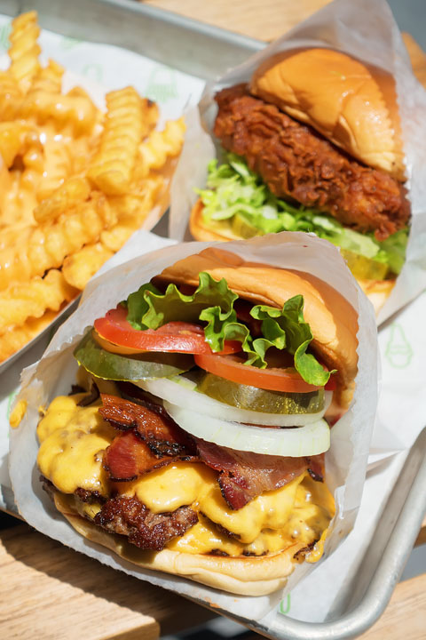 Burger with Fries and a Chicken Sandwich Image of a Burger with Fries and a Chicken Sandwich from Shake Shack
